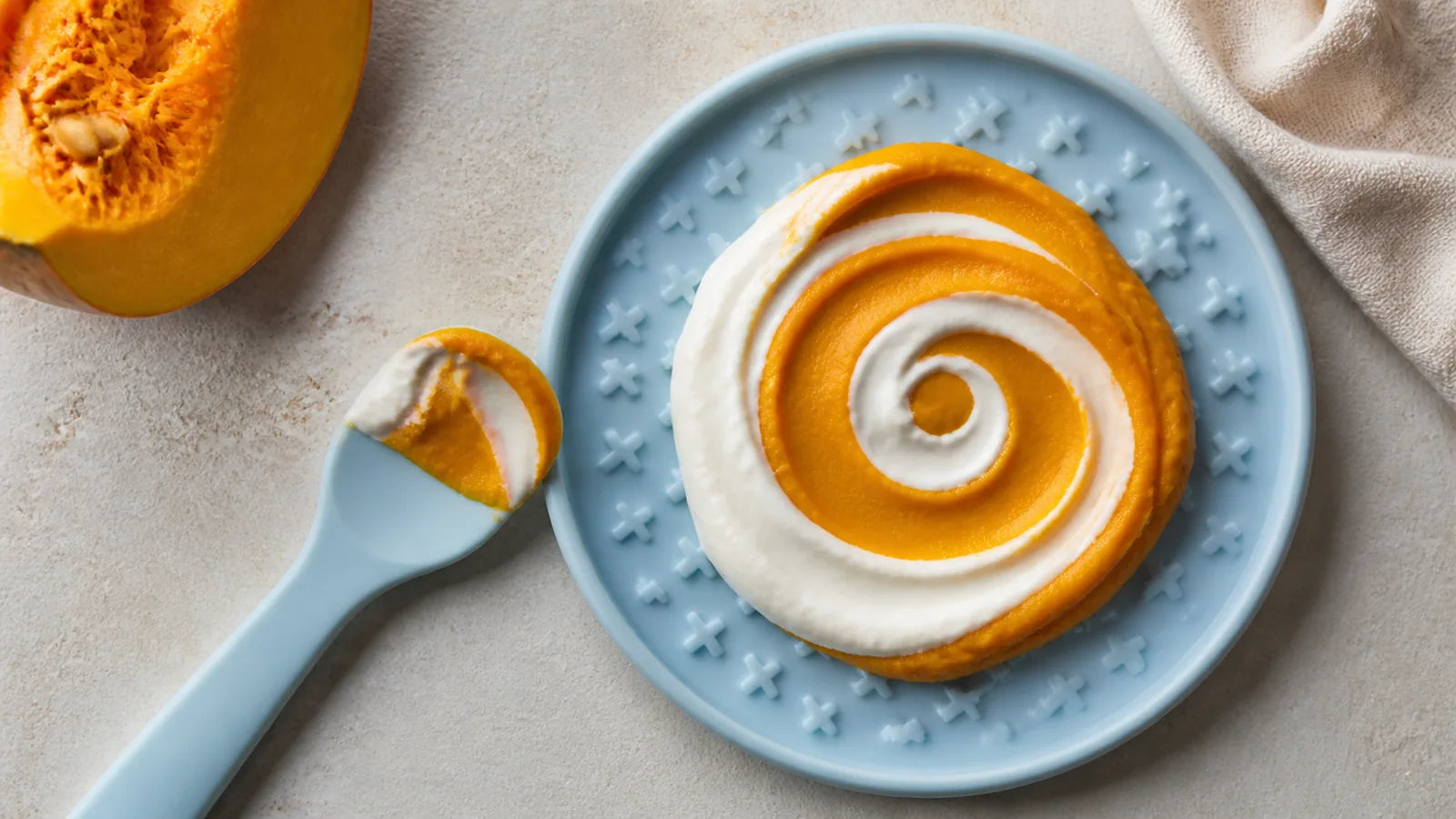 Pumpkin and yogurt arranged on a blue enrichment feeder